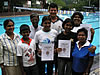 Proud parents and siblings pose with Sri Lankan STA swimming teacher, Pauline Wijesinghe